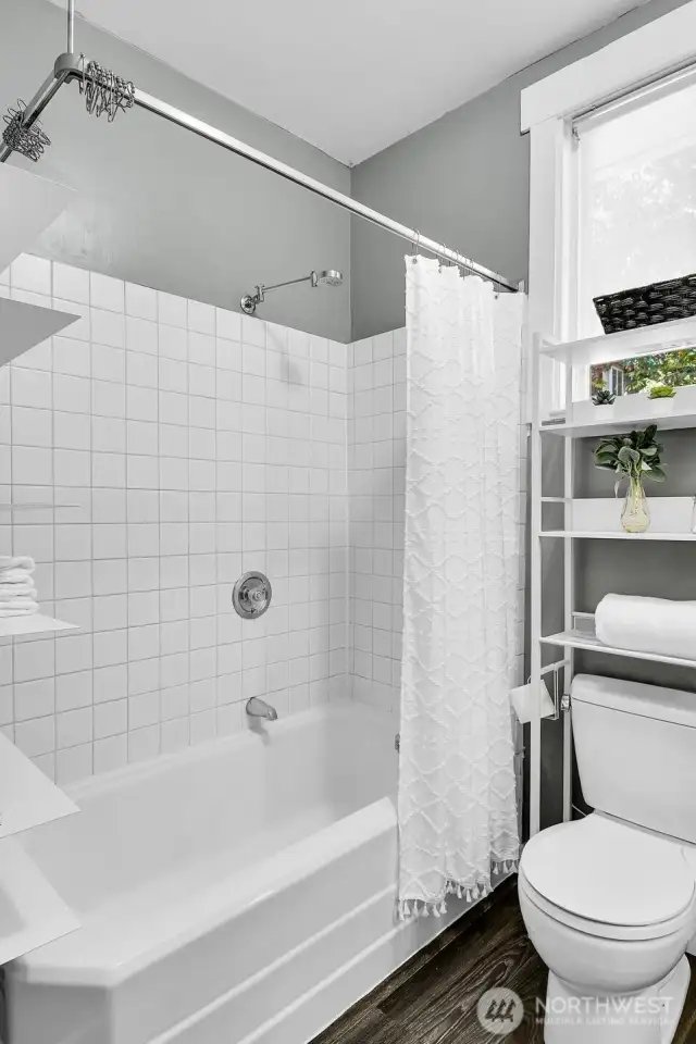 Continental full bath with lots of storage.