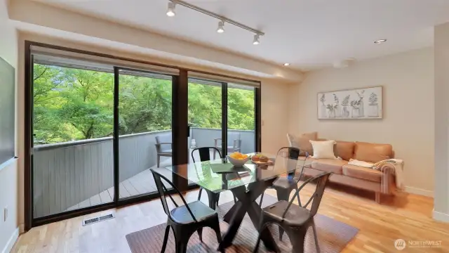Enjoy this formal dining area with double sliding doors that create a seamless flow to the outdoor seating space.