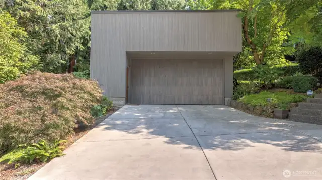 Benefit from ample driveway parking and an attached two & a half-car garage framed by mature greenery.