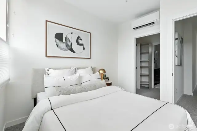 Primary bedroom with walk-in closet and ensuite bathroom