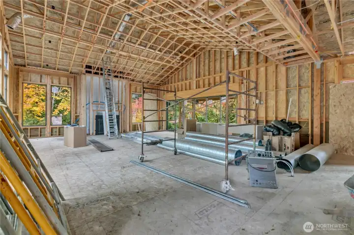 View of the spacious family room, taken from the kitchen. Home as of 10/23
