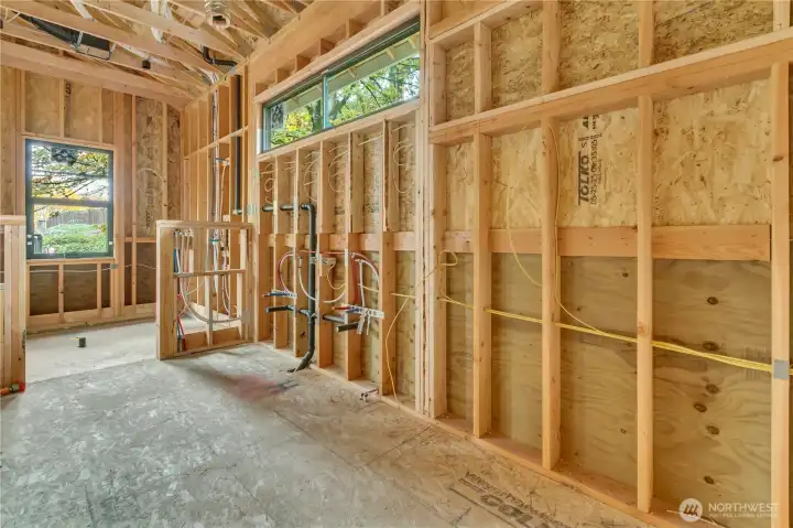 Primary Bathroom with double vanity sinks under high windows and fully tiled wet room with soaking tub and shower.  Home as of 10/23