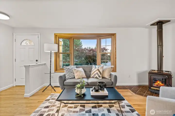 Bright main living area with hardwood floors and access to the backyard retreat