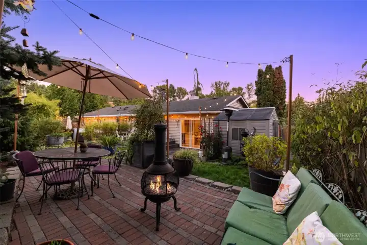Spacious back patio designed for outdoor dining, entertaining, and relaxation
