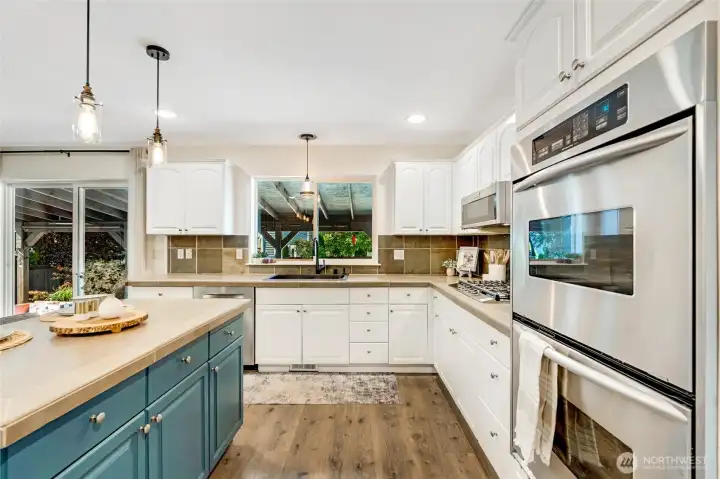 Warm vibe to this chef inspired kitchen