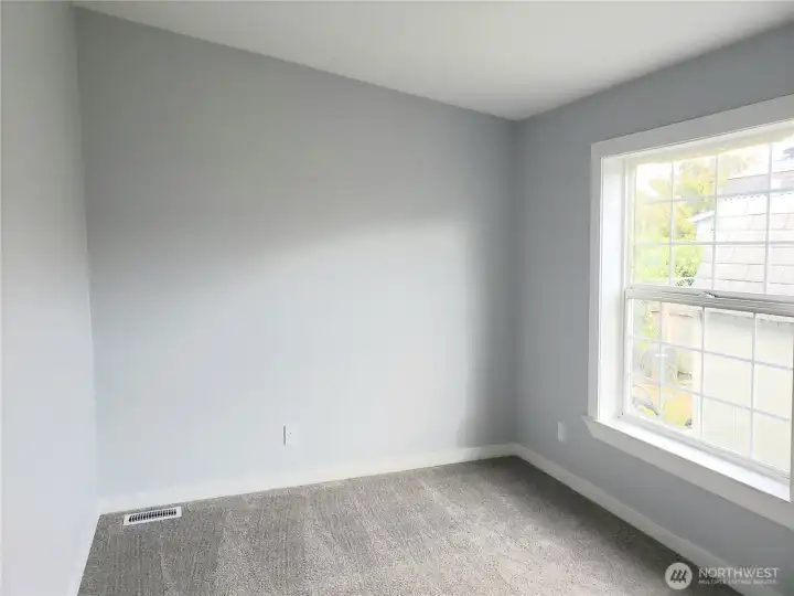 Picture of the Den, Media Room or Extra Living Room with New Paint, Trim and Carpeting.