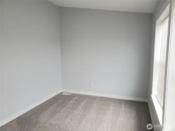 Picture of the Den, Media Room or Extra Living Room with New Paint, Trim and Carpeting.