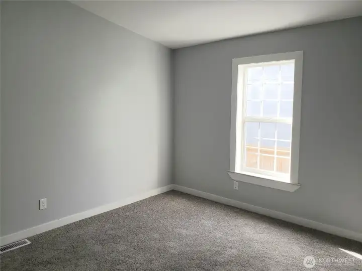 Spacious Second Bedroom with New Paint, Trim and Carpeting.