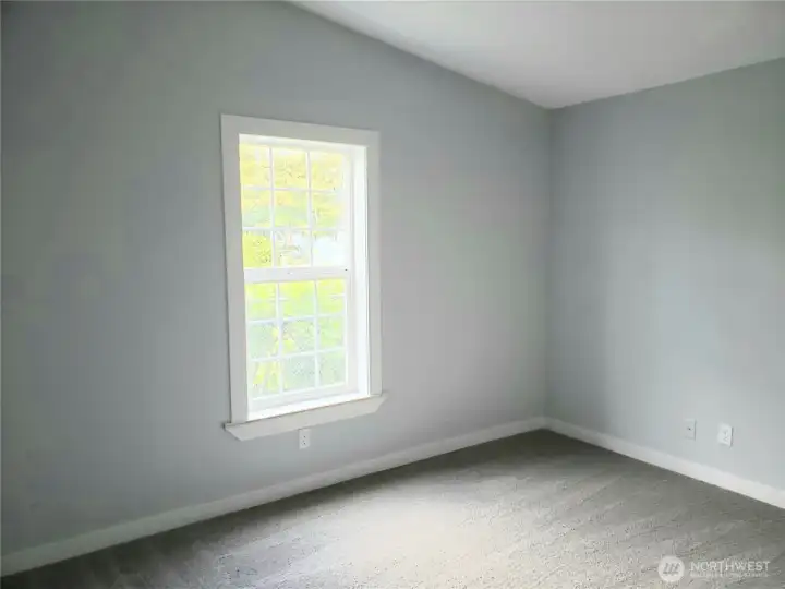 Picture of the Spacious Third Bedroom with New Paint, Trim and Carpeting.