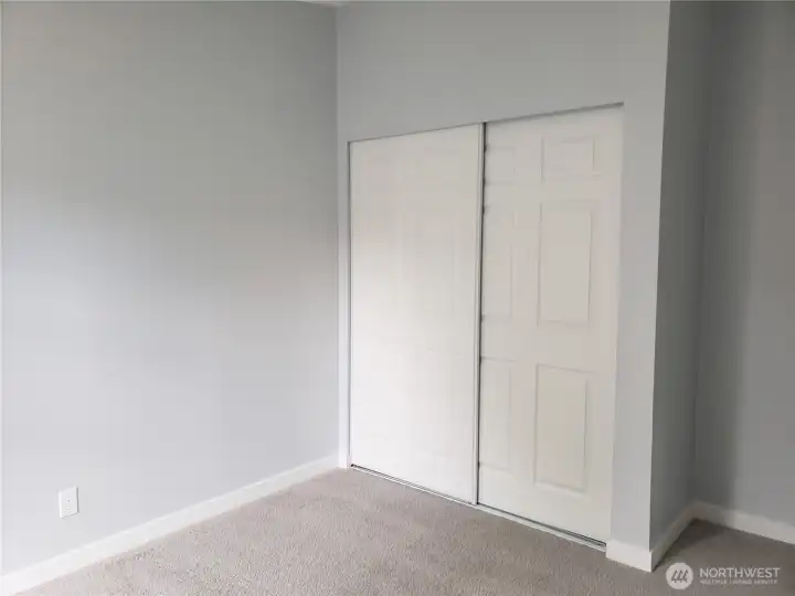Another Picture of the Spacious Third Bedroom with New Paint, Trim and Carpeting Showing Large Closet.