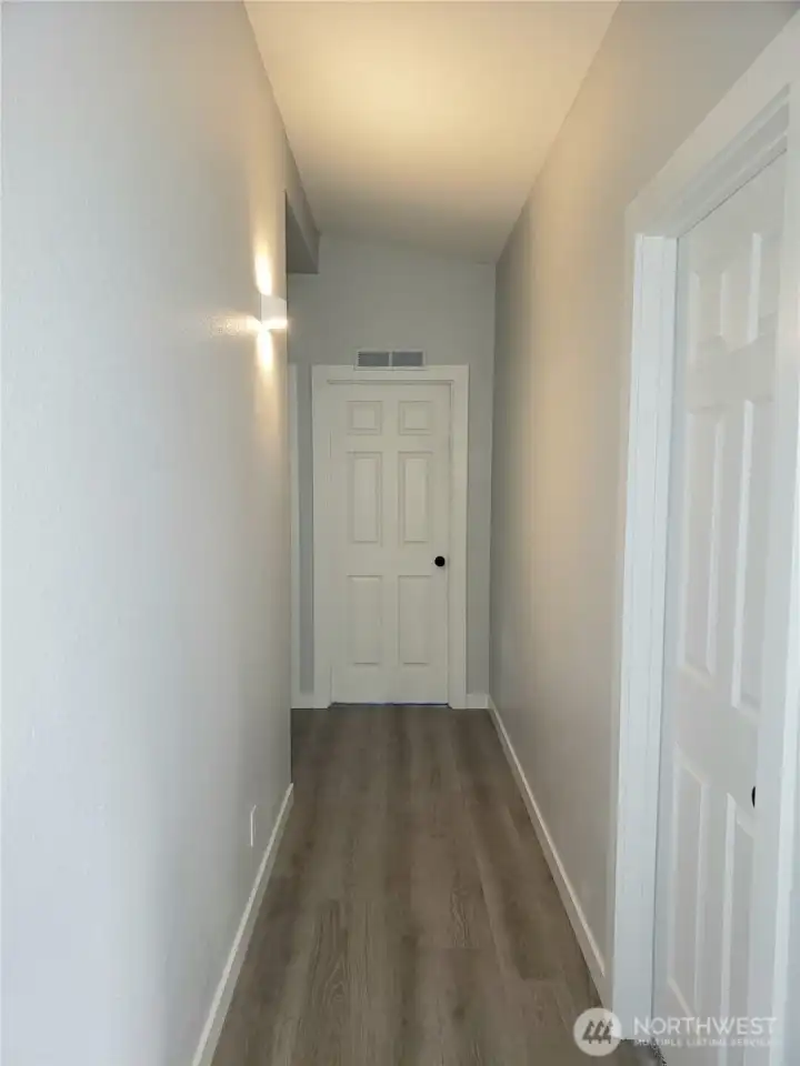 A Picture of the Hallway with a Motion Censor Light that goes on in the Dark.