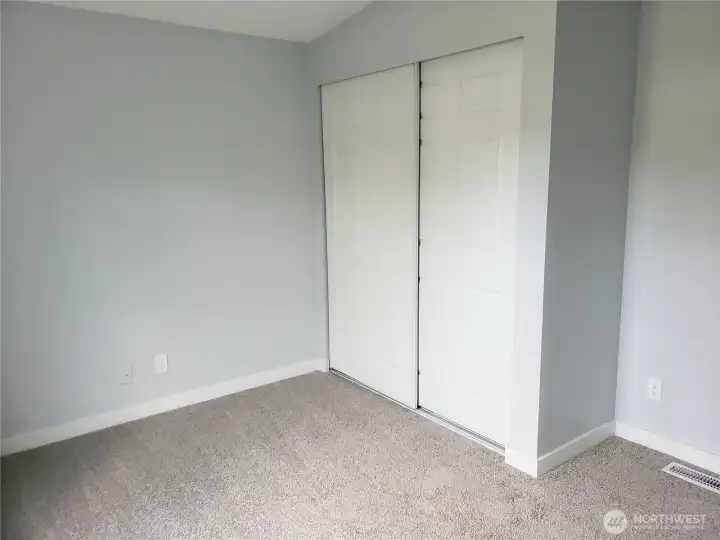 Another Picture of the Spacious Fourth Bedroom with New Paint, Trim and Carpeting Showing Large Closet.