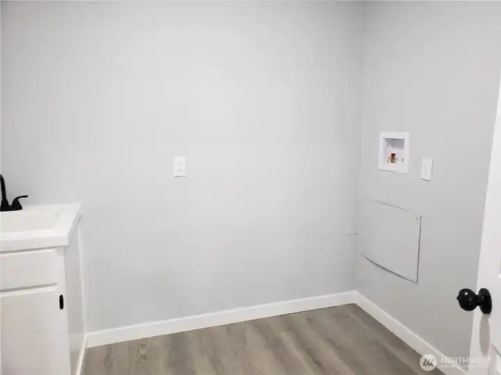 Another View of the Nice Utility Room with New Vanity, Washer and Dryer Hook Ups.
