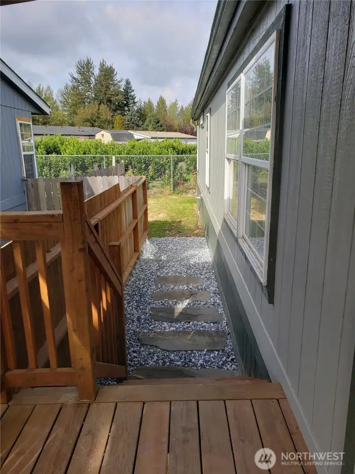 Another picture showing New Covered Front Porch and Walkway to the Backyard.