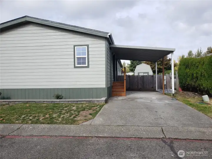 Another Front View of the Home with New Siding, Trim and Complete Exterior Paint Showing Room for 2 Vehicle Parking, New Covered Porch and Carport.