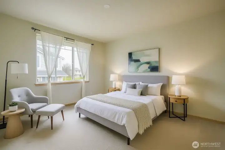 Spacious and serene, the primary bedroom offers plenty of room for a king-sized bed and cozy sitting area. Virtual staging illustrates the ideal balance of style and comfort, helping you envision your own peaceful retreat.