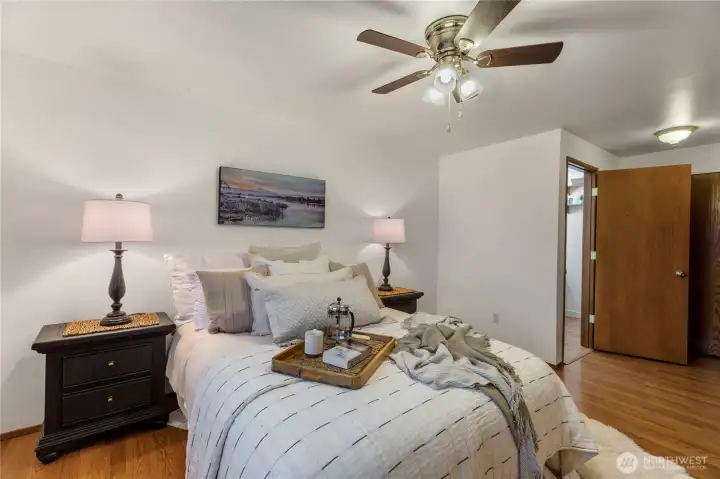 Primary bedroom with 1/2 bath attached and two closets