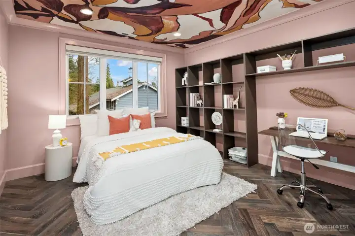 The third bedroom is thoughtfully designed, featuring custom shelves that provide practical storage solutions while enhancing the room's aesthetic. This bedroom also includes a private en-suite bathroom, offering convenience and privacy.