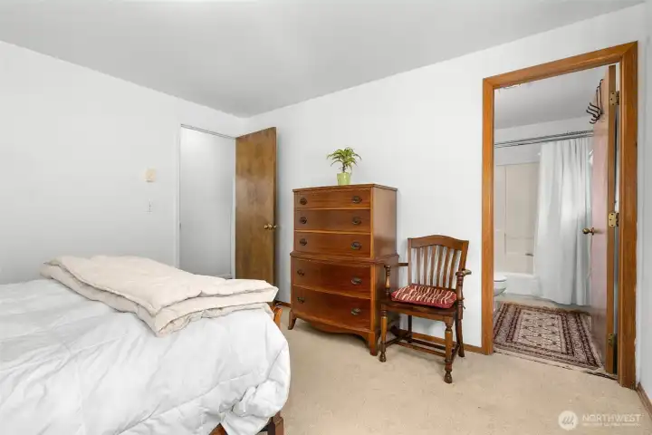 Primary bedroom with adjacent bathroom and walk-in closet for added privacy and convenience.