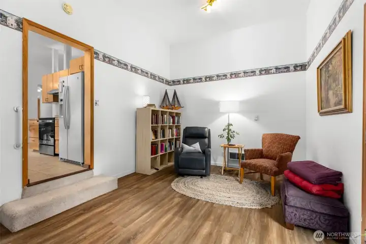 Finished bonus room with LVP flooring and exterior door—ideal for office, media room, or hobbies.