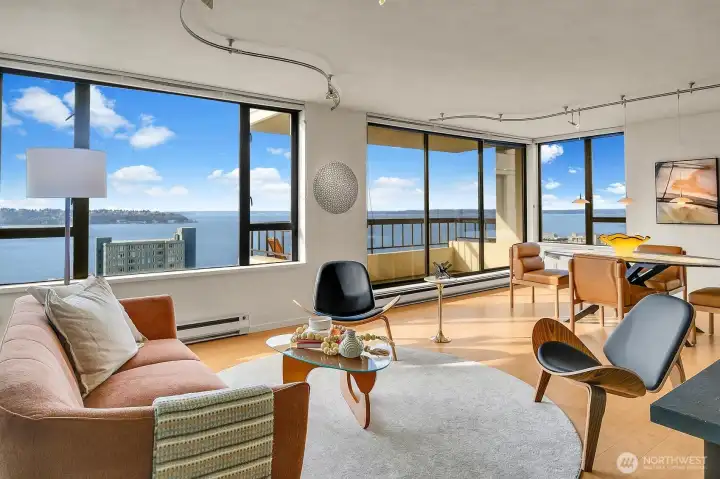 Welcome home to this spectacular home in the sky! The ultimate Seattle Lifestyle...the Puget Sound at your feet, stunning views of the Olympic Mountain range and city lights. One watches the world float by..frieghters, curise ships, eagles soar and the occasional orcas may be sighted! And did we mention the gorgeous sunsets? This home designed by a renowned national architect, will take your breath away. There are three private balconies to enjoy the ever-changing views. Light-filled with western exposure, this home features abundant light. This urban oasis provides easy access to all that Seattle offers- Pike Place Market, the Olympic Sculpture Park, the Space Needle, the new waterfront promenade and Aquarium.