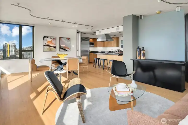 Open floorplan provides gracious spaces and flow for entertaining and everyday living.  This is looking from the living room into the dining room and kitchen.