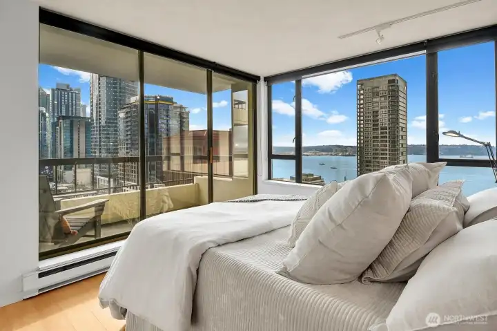The primary suite has views from your pillow!  Daytime features the city and the soothing Puget Sound...and features brilliant city lights at nighttime!