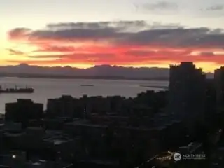Gorgeous outline of the Olympics, brilliant sky and a freighter floating by.