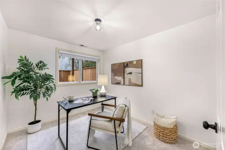 Convenient office or guest room on main floor with access to full bathroom.