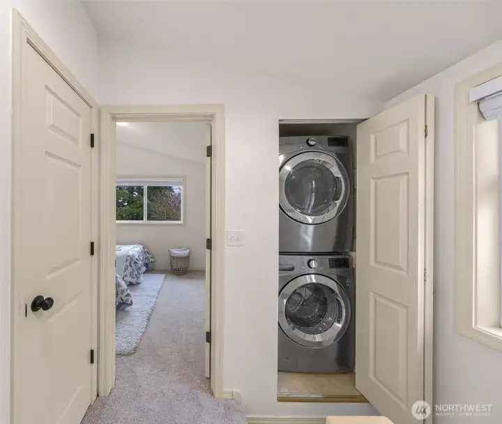Convenient laundry room on floor with primary bedroom!