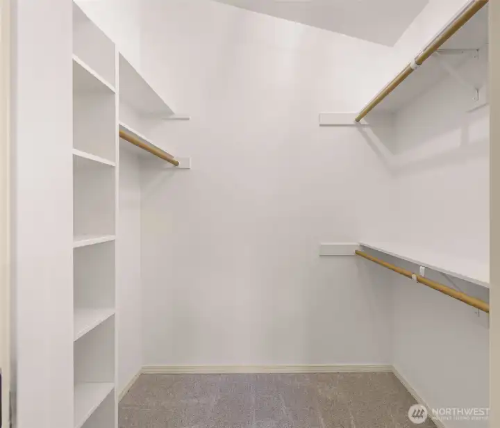 Primary bedroom walk in closet.