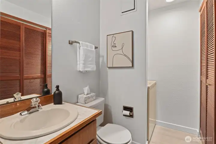 Main level powder room and laundry.