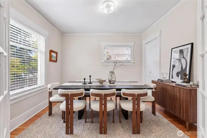 Virtually staged main floor dining or bedroom