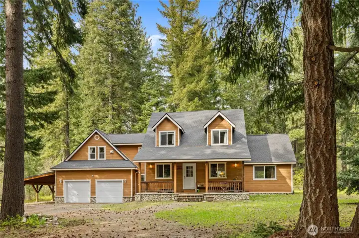 Nestled among towering evergreens at the end of a quiet dead-end road, this cabin offers privacy and serenity.