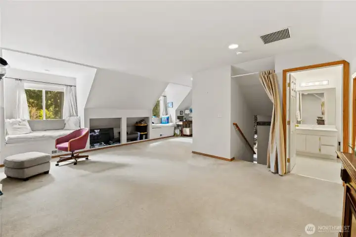 Guest primary suite with attached bath for added comfort and privacy.