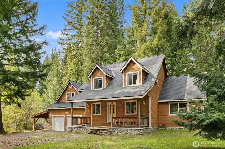 Settled in a clearing amidst the towering evergreens, this Lake Cle Elum cabin is a must see!