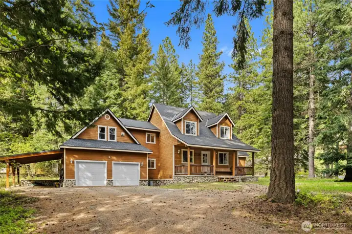 2 car garage with carport offers plenty of room to store all your toys.