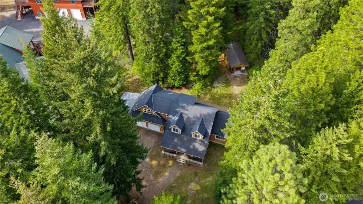 Settled in the trees on Cozy Lane with easy access to unlimited outdoor recreation.