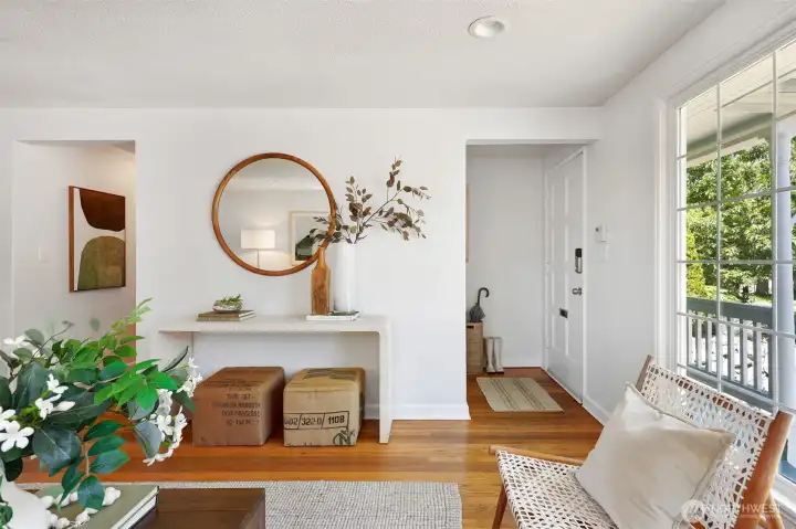 Welcoming entry, hardwood floors in living room.