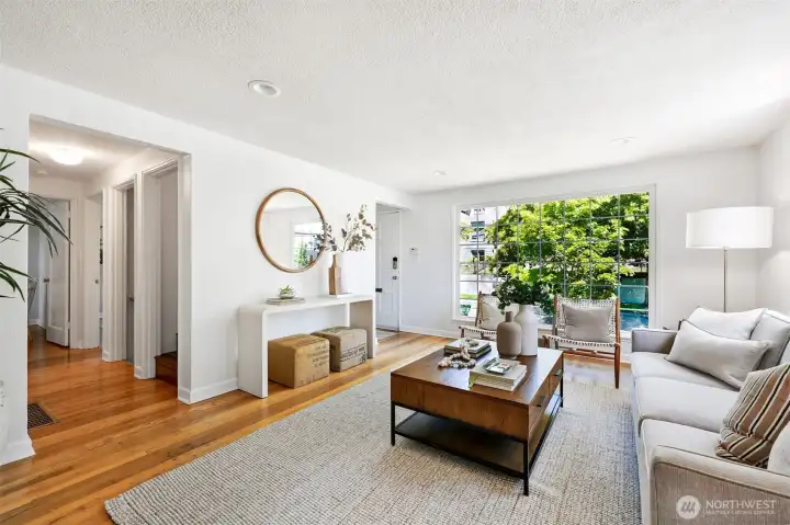 Oversized windows in living room accentuate the corner lot and territorial view.