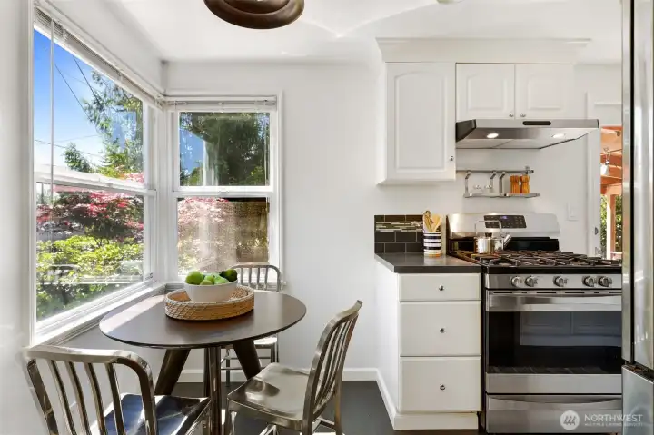 Kitchen with eating area, windows face east & south.