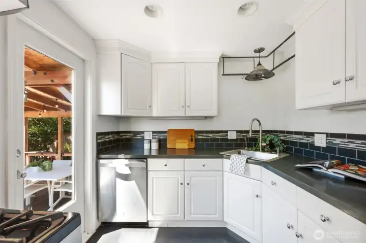 Kitchen has pass though to deck & backyard.