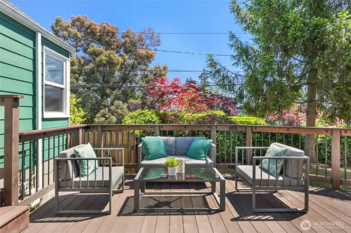 Private deck situated in a fenced back yard.
