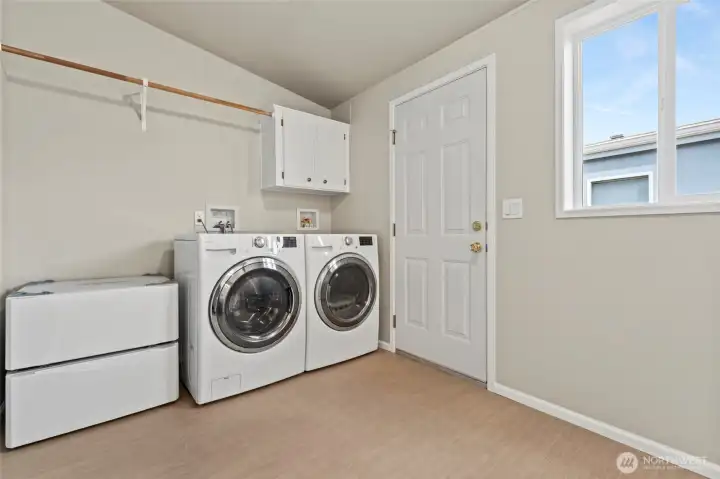 The large utility room is located off the kitchen and hall bath. If you are looking to create additional space, this room is the place for to bring your creativity -- home office, craft room....? What's your dream? The large utility room is located off the kitchen and hall bath. If you are looking to create additional space, this room is the place for to bring your creativity -- home office, craft room....? What's your dream?