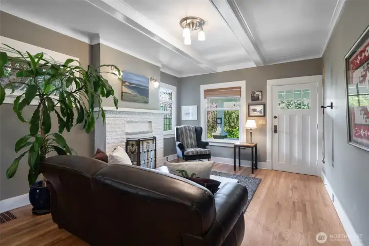Fully restored and functional wood burning fireplace and original box beam ceilings