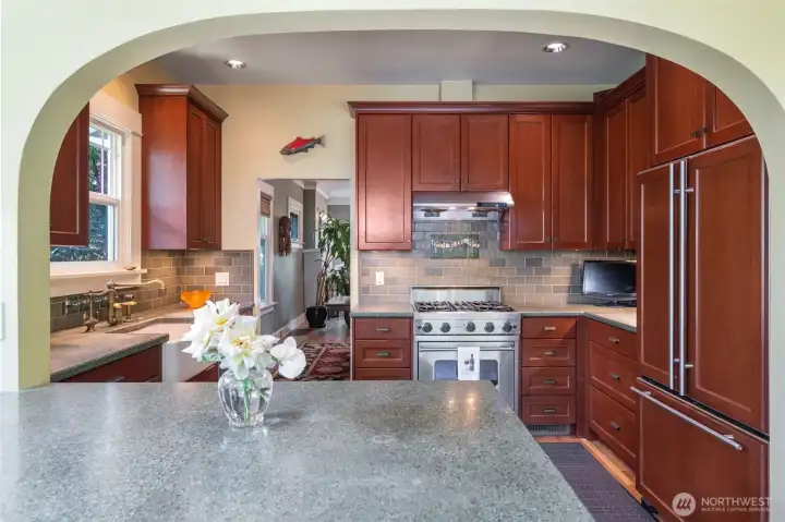 Sustainable Trinity glass countertops and handmade artisan tile backsplash