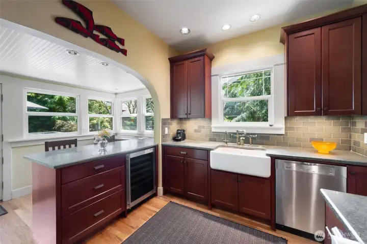 Shaws enameled cast iron farmhouse sink, Rohl plumbing fixtures. Wine Enthusiast wine fridge