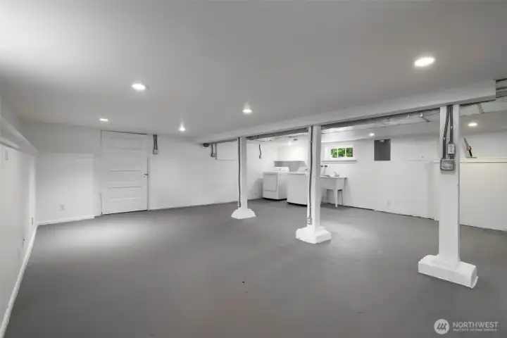Partially finished lower level with permitter drain system and zones for TV, Office, and utility