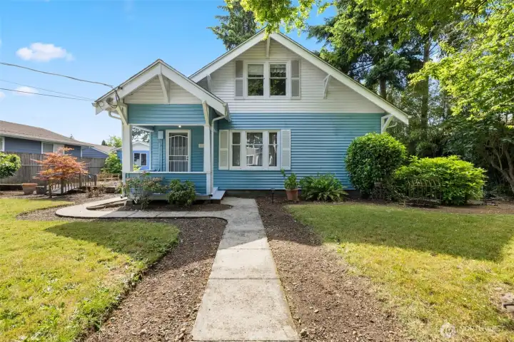Cute little home with a large yard, covered front porch, and sweet charm.