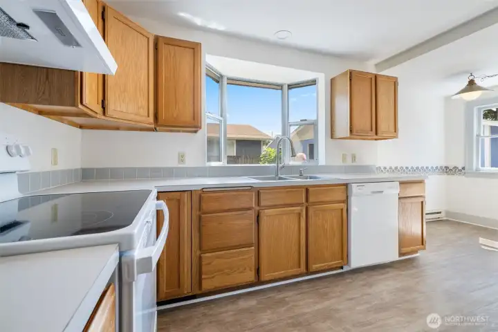 The kitchen is good sized and has new flooring, new counters, and a sweet eating nook.